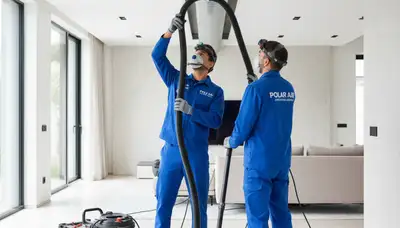 Technician cleaning air ducts for HVAC system in Flint, MI home – Five Star Cooling service
